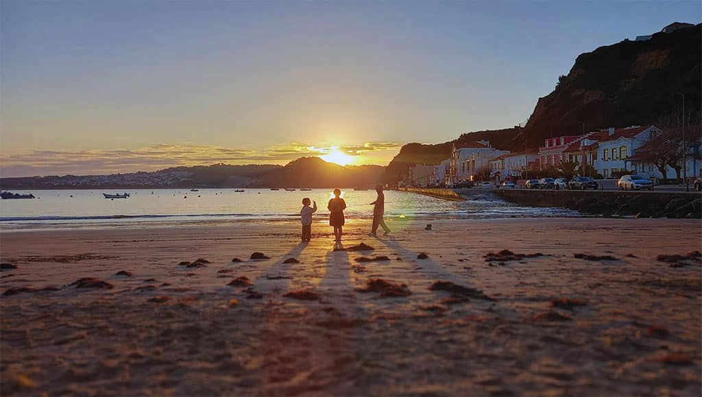 children playing on the beach|seafront