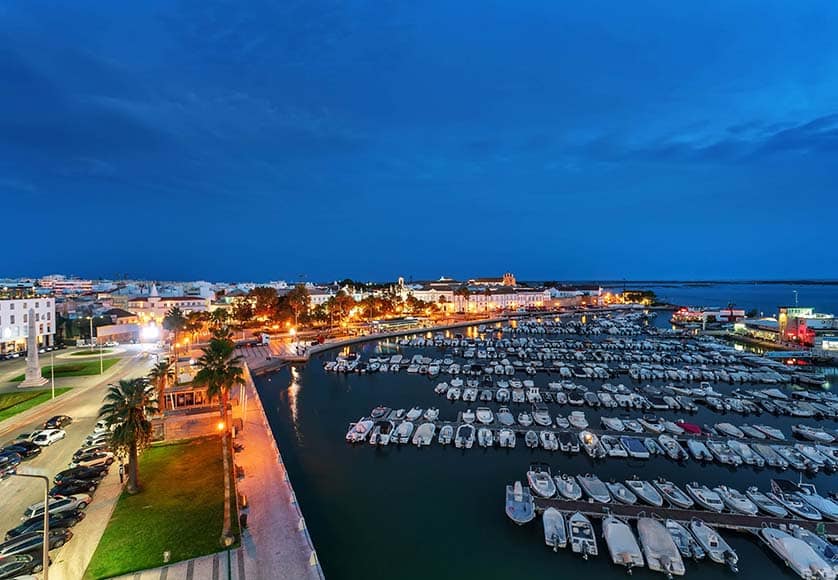 View from Faro Hotel Eva’s Harune restaurant by night|Nestling in the hills of Arruda dos Vinhos|(From left) Mauro Lopes and Angela Almeida of Quinta de São Sebastião, with event organiser Nigel Adams (AWS).|The Harune restaurant proved a great venue for the AWS