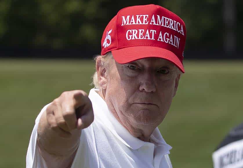 epa10658875 Former US President Donald J. Trump gestures while greeting golfers at the driving range before the start of the second round of 2023 LIV Golf DC at Trump National Golf Club in Sterling, Virginia, USA, 27 May 2023. The 2023 LIV Golf DC golf tournament takes place from 26-28 May, 2023. EPA/MICHAEL REYNOLDS