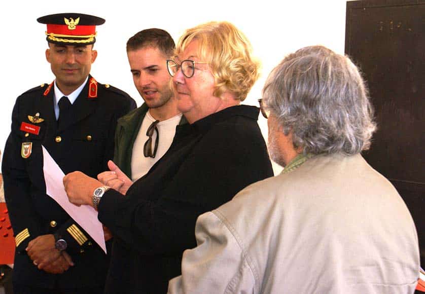 Vítor Martins and Fábio Barros (Vice President), Bombeiros de São Brás de Alportel, with Dr José Alves Farinha and Jo Blackman, both of Christ The King Anglican Church|Jane Caulfield-Kerney (centre) presenting one of the 42 Christmas gifts to Dra Sandra Vale, President ASCA, and Vitalina Azevedo, Director ASCA|Sandy MacDougall (right) presenting one of a bundle of hand-made blankets to Kaye Jones from the Portimão Soup Kitchen