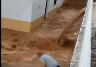 Raging torrents of muddy water flood Alentejan village