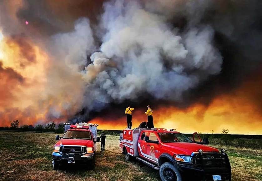 Firefighters near Fort St. John, British Columbia, on Sunday. Credit...Kamloops Fire Rescue, via Reuters