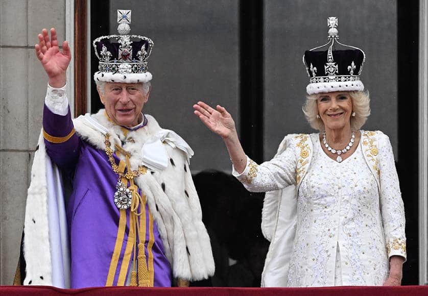 Britain's King Charles III and Queen Camilla wave from the balcony of Buckingham Palace following their Coronation in London on May 6, 2023