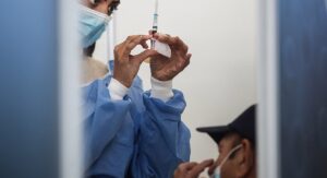 Pharmacists unhappy they are blocked from vaccinating country’s oldest citizens
