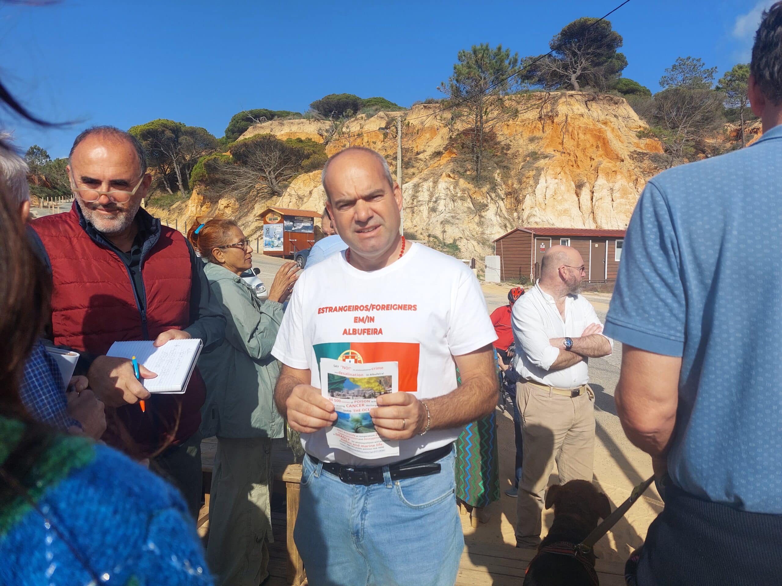 Paolo Funassi with one of the flyers his group will be distributing throughout Albufeira|Albida Ferreiro and her family say they will fight the compulsory purchase of their land "to the end"|Albufeira's Praia da Falésia