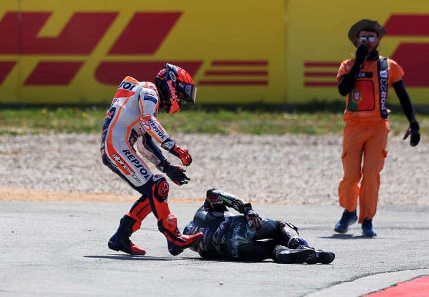 Spanish MotoGP rider Marc Marquez (L) of Repsol Honda Team tries to help Portuguese MotoGP rider Miguel Oliveira of CryptoDATA RNF MotoGP Team after a crash during the MotoGP race at the Motorcycling Grand Prix of Portugal at Algarve International race track, Portimão, Portugal, 26 March 2023. EPA/NUNO VEIGA