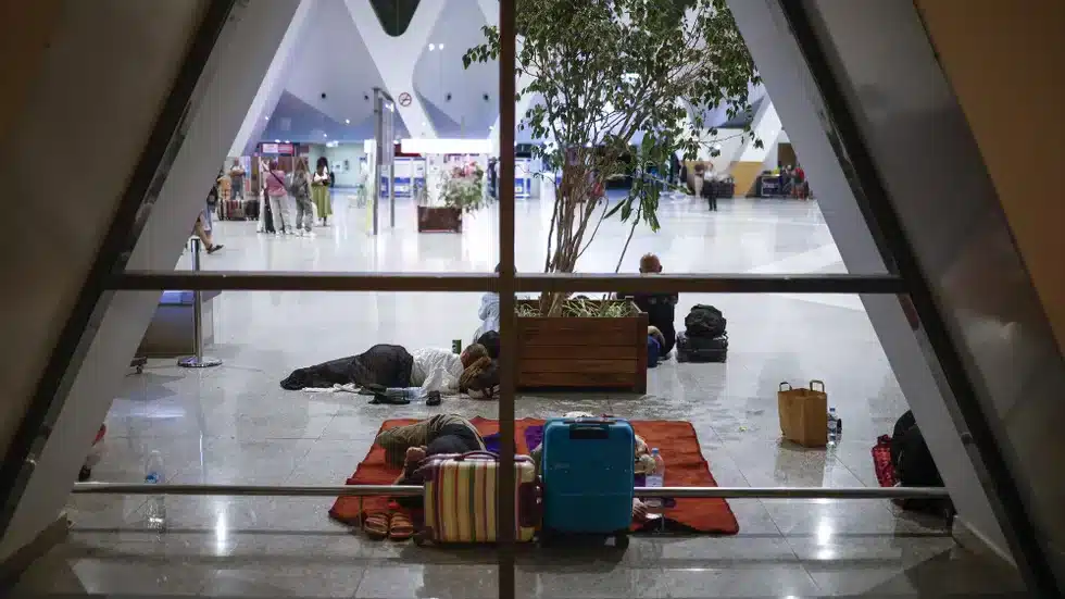 Person sleeping on airport floor
