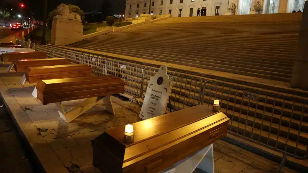Police place eight coffins outside parliament, one for every year of Socialist government