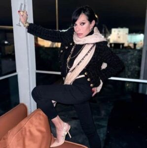 Transvestite socialite formally accused of domestic violence against 95-year-old former wife