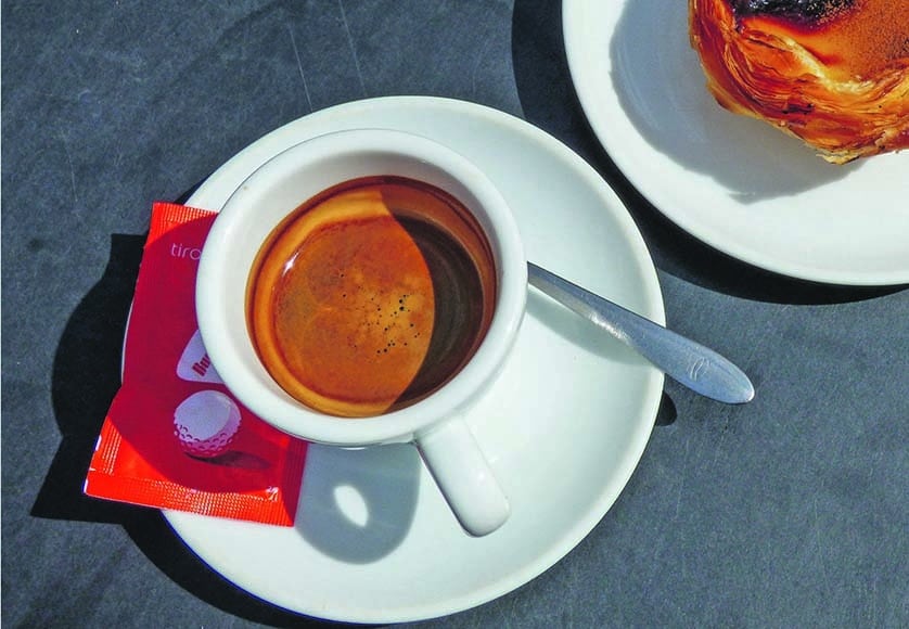 A coffee in Lisbon, also known as a 'bica'|The entrance to 'A Brasileira' in Lisbon