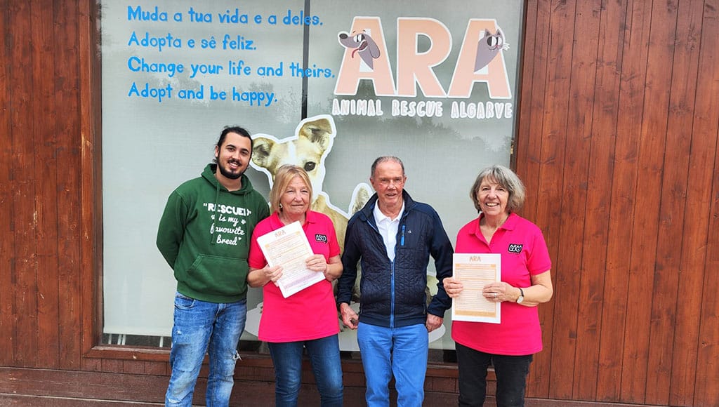 ARA-APAA sign up, from left: João Ferreira (ARA), Anita Wight (APAA), Sid Richardson (ARA) and Jenny Clarke (APAA)|Visit APAA at the Ferragudo Car Boot Sales, Fair and Street Market