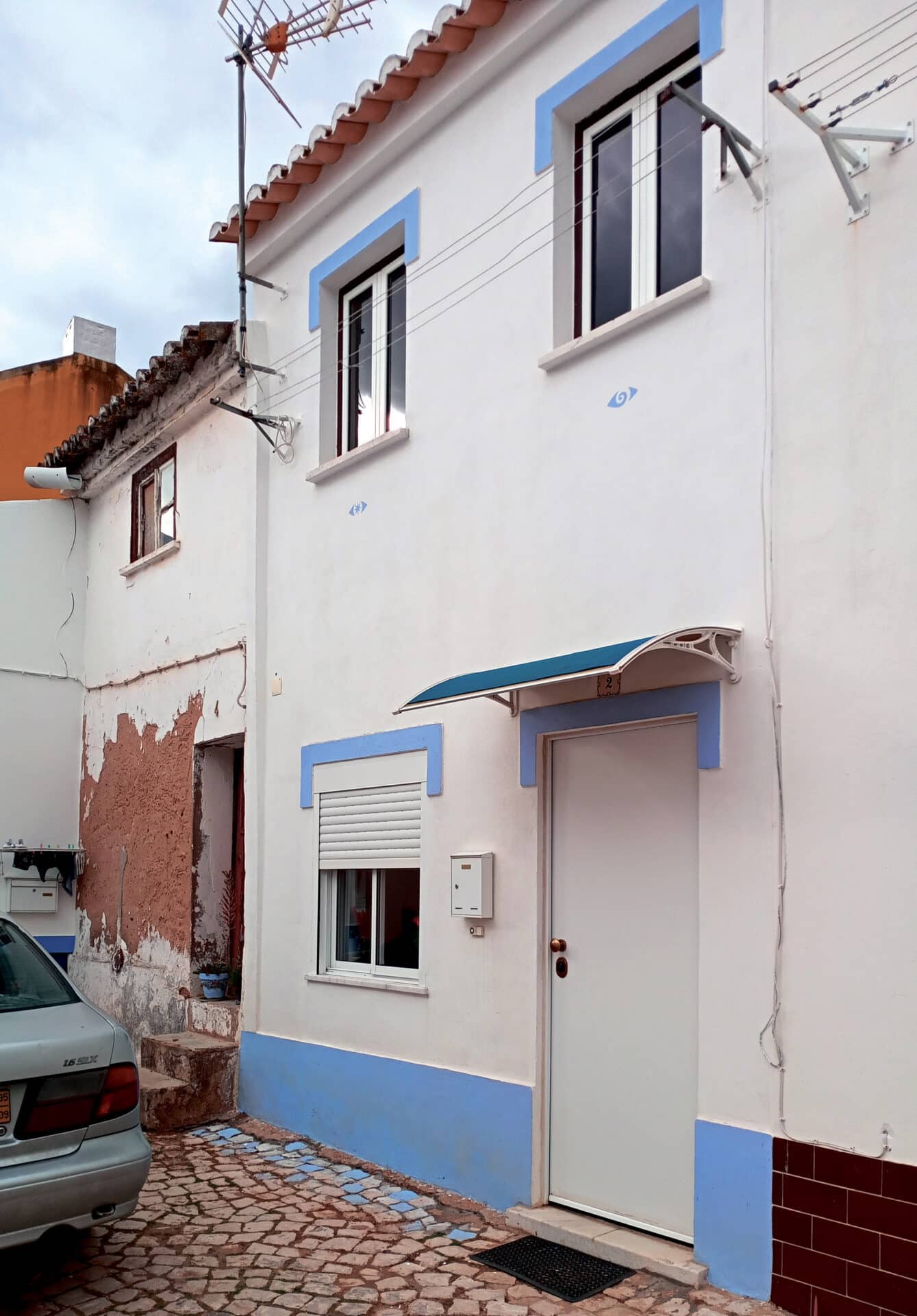 AFTER - (Back row from left): Peter Dickinson, Gary Lipscombe, Andy Smith, Martyn Farr, Chris Wright, Mark Fox and Juan Condeto; (front row from left): Tracey Lipscombe, Tanya Fox, Julie Dickinson and Jane Westray|BEFORE – The neglected cemetery|BEFORE – The neglected cemetery