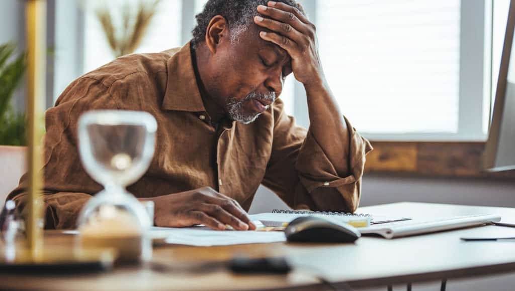 Senior business man concerned thinking about online problem. Frustrated worried senior middle aged male suffering from memory loss, having a headache.|Mountain landscape with hiking trail and view of beautiful lakes Ponta Delgada, Sao Miguel Island, Azores, Portugal.