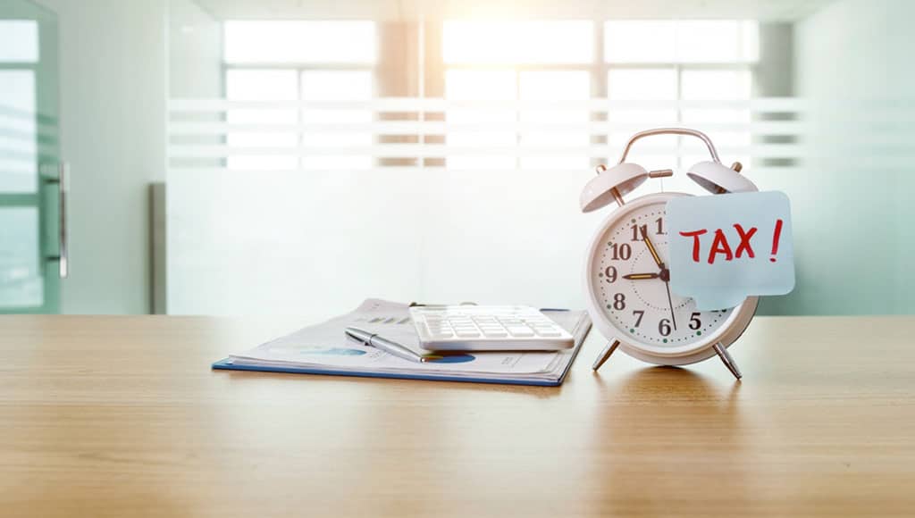 Alarm,Clock,With,Word,Tax.|Famous arch at the Praca do Comercio, Lisbon, Portugal