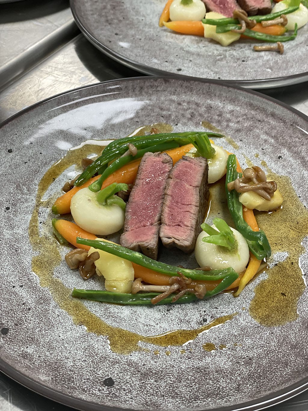 Beef with vegetables and a delicate jus|Frog legs with a parsley and a garlic sauce|Pike fish with an onion tarte and a red wine sauce