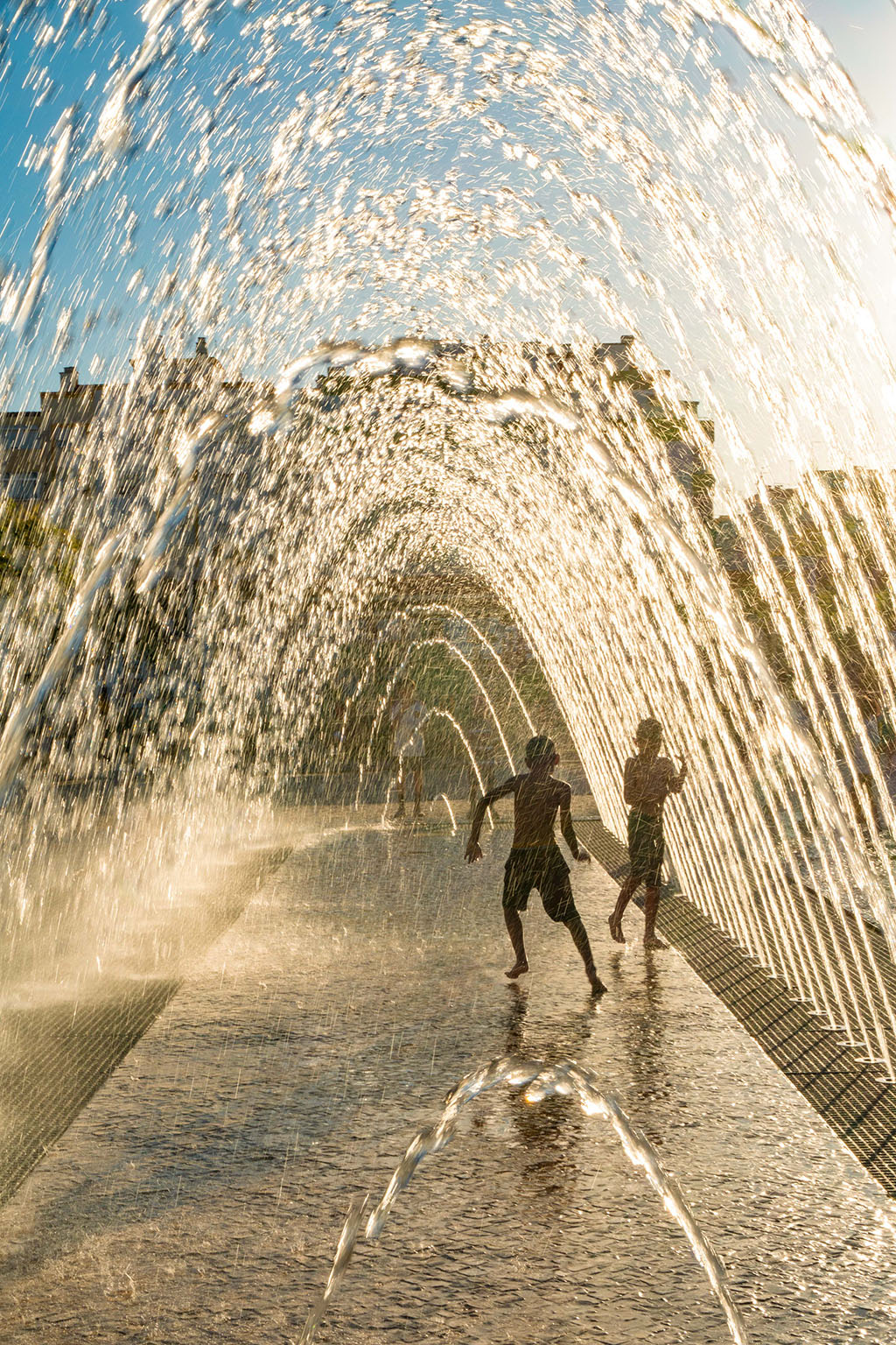 Boys play in fountain, Portimão