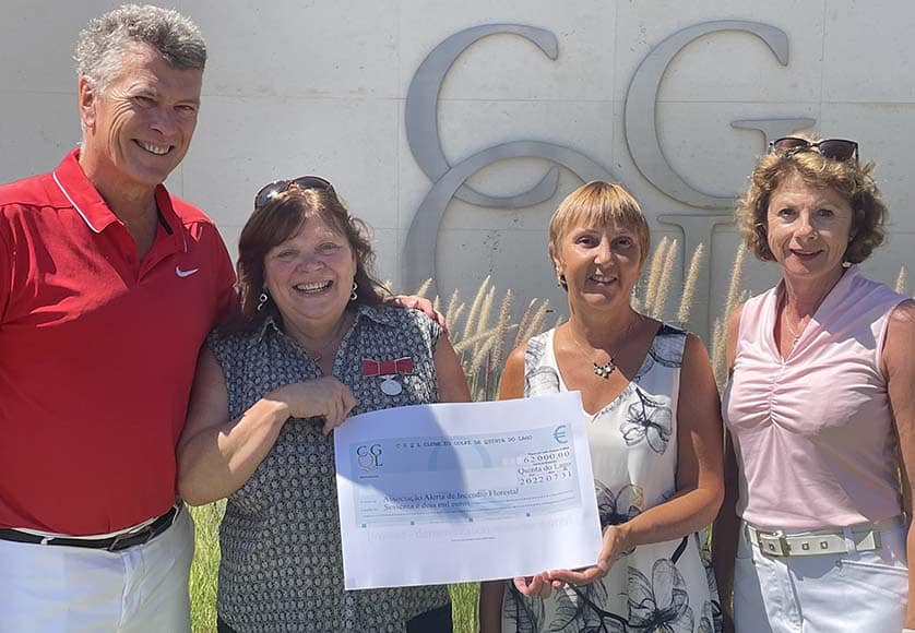 Debby Burton and Barbara Leitch from Alerta receive the cheque for €62,000 from Club Captains Alan and Lesley Henderson