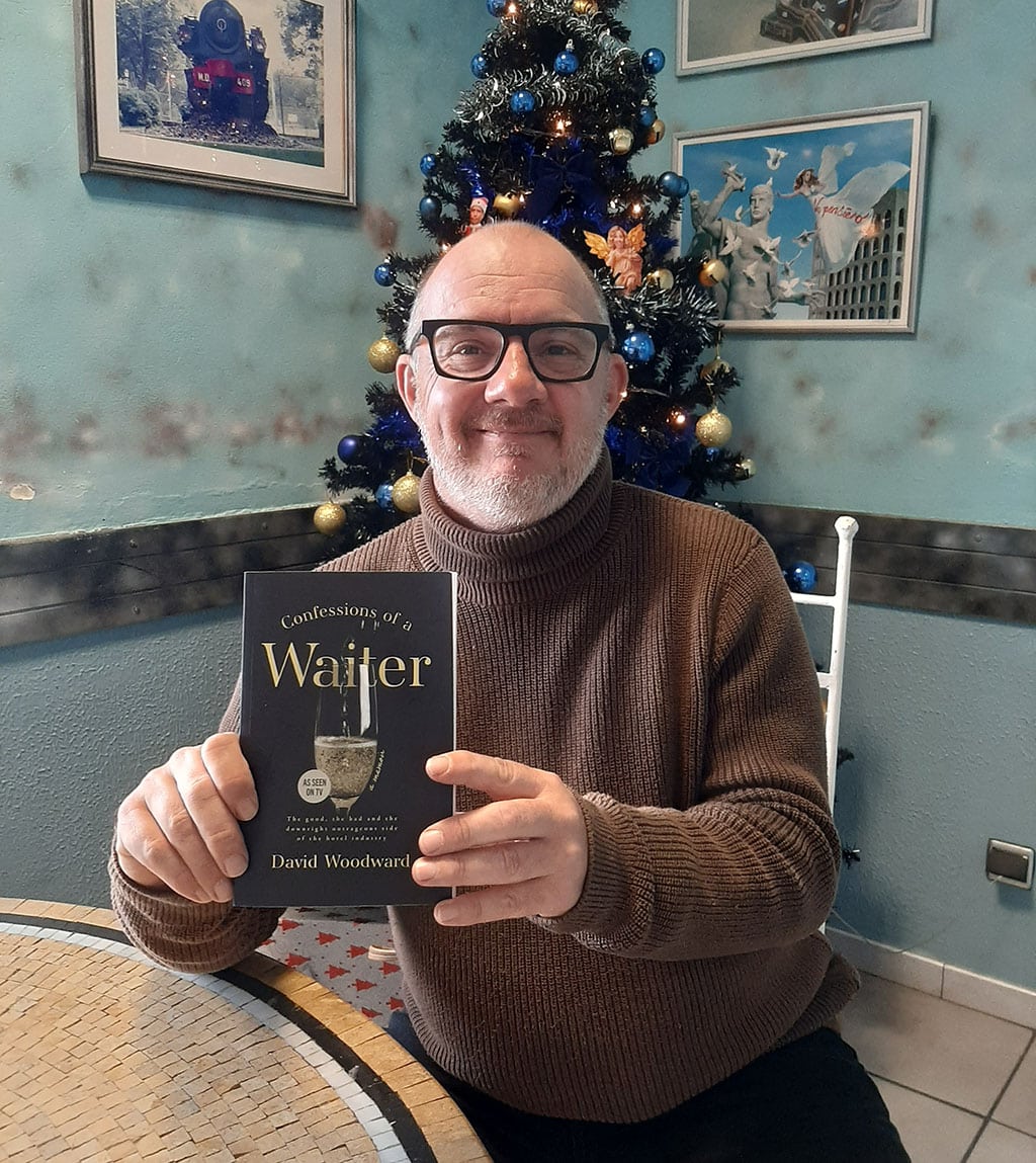 David Woodward|Confessions of a Waiter book cover|Part of the proceeds of the book’s sales will go to help Tiny Shelter in Albufeira, from which David adopted his new Pitbull companion, Freddie
