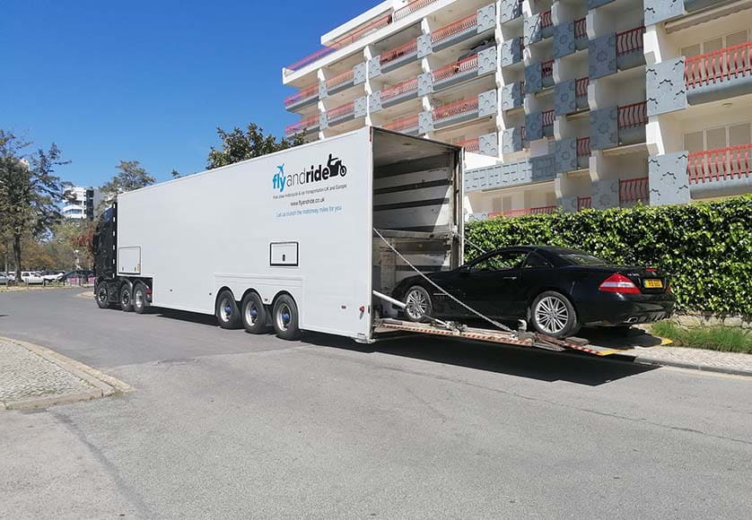 Fly and Ride|Photo of the back of one of Fly And Ride transporters in a city avenue