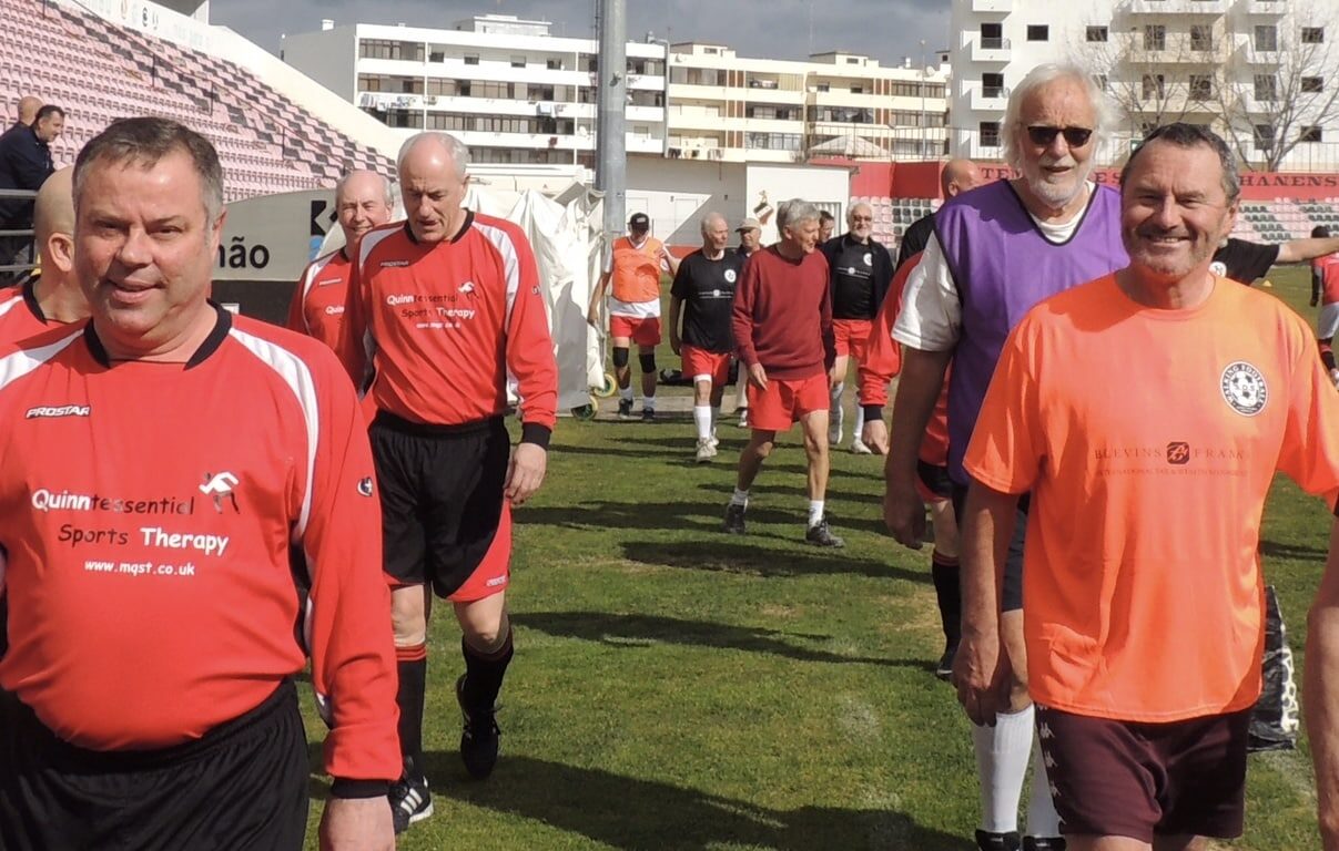 Former UK Vice Consul Clive Jewell (far right) leads the teams out at the José Arcanjo Stadium, Olhão|Walking football - you are never too old to have a go!|Paul Shaw towers above 91-year-old Maria Ferreira
