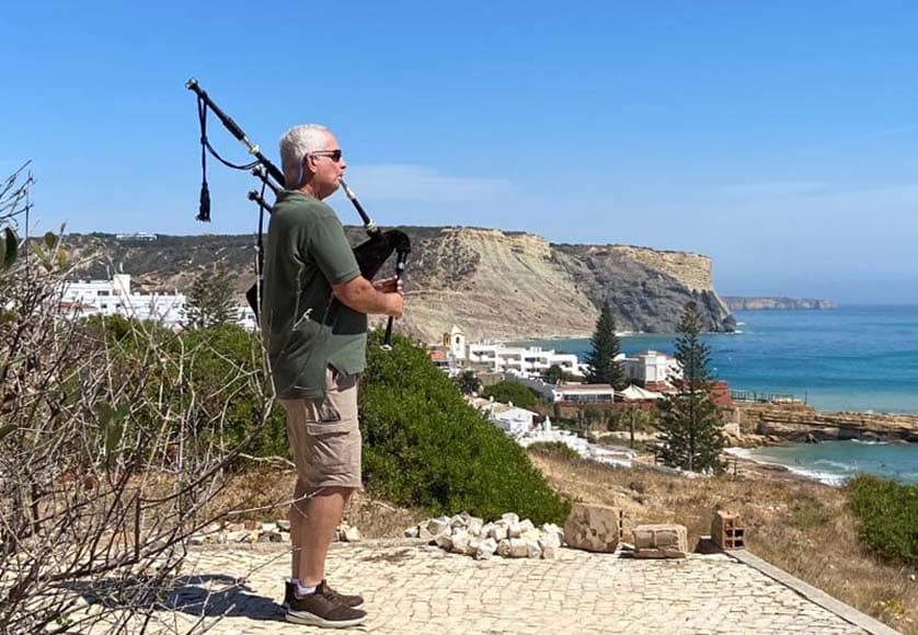 Glenn piping in Praia da Luz|Glenn and Glenda in paradise