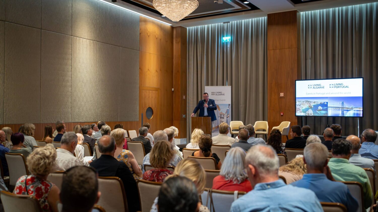 Bruce Hawker, CEO of Open Media and event organiser, addressing the audience at the "Living in the Algarve" seminar at the Conrad hotel, Quinta do Lago, last month - Photo: Inês Pascoal|Living in the Algarve, Conrad, September 2024 - Photo: Inês Pascoal|Living in the Algarve, Conrad, September 2024 - Photo: Inês Pascoal|Property panel at the Conrad event, from left, Sean Moriarty, CEO Quinta do Lago, Zoie Hawker, Managing Director, Fine & Country Algarve and Gerry Fagan|Living in the Algarve, Conrad, September 2024 - Photo: Inês Pascoal|Open Media events: South Africa and Vilamoura seminars in November