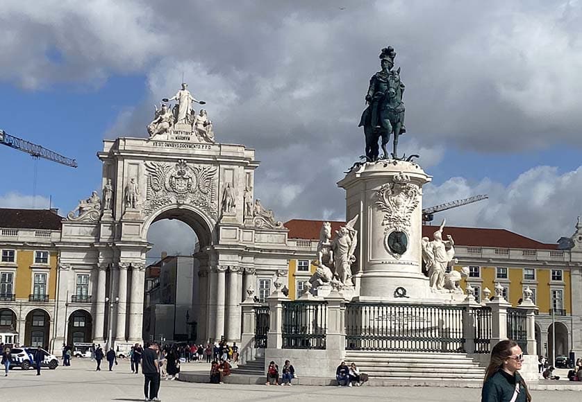 A view of the Praça do Comércio, showing the equestrian statue of King José I, with a 19th century triumphal arch in the background|The statue of General Marquês de Sá da Bandeira (1795-1876) was erected in the Jardim Dom Luís I in 1884|Looking from the Praça do Comércio across the Tagus towards the resplendent and enormous statue of Cristo Rei, opened in 1959|One of the colourful 1930s style trams that make getting around Lisbon so memorable|A view of the Alfama looking east towards the Tagus from a viewpoint near the Castelo São Jorge|The Sé, Lisbon’s 12th century Romanesque cathedral in the Alfama quarter