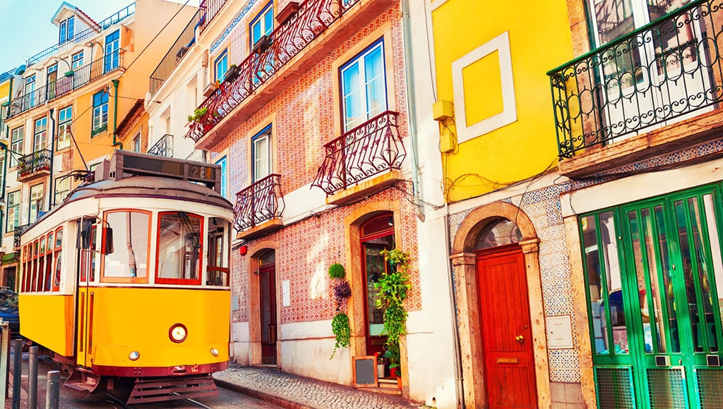 Yellow,Vintage,Tram,On,The,Street,In,Lisbon,,Portugal.,Famous