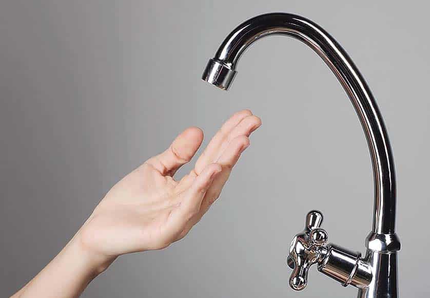 hand under a water tap