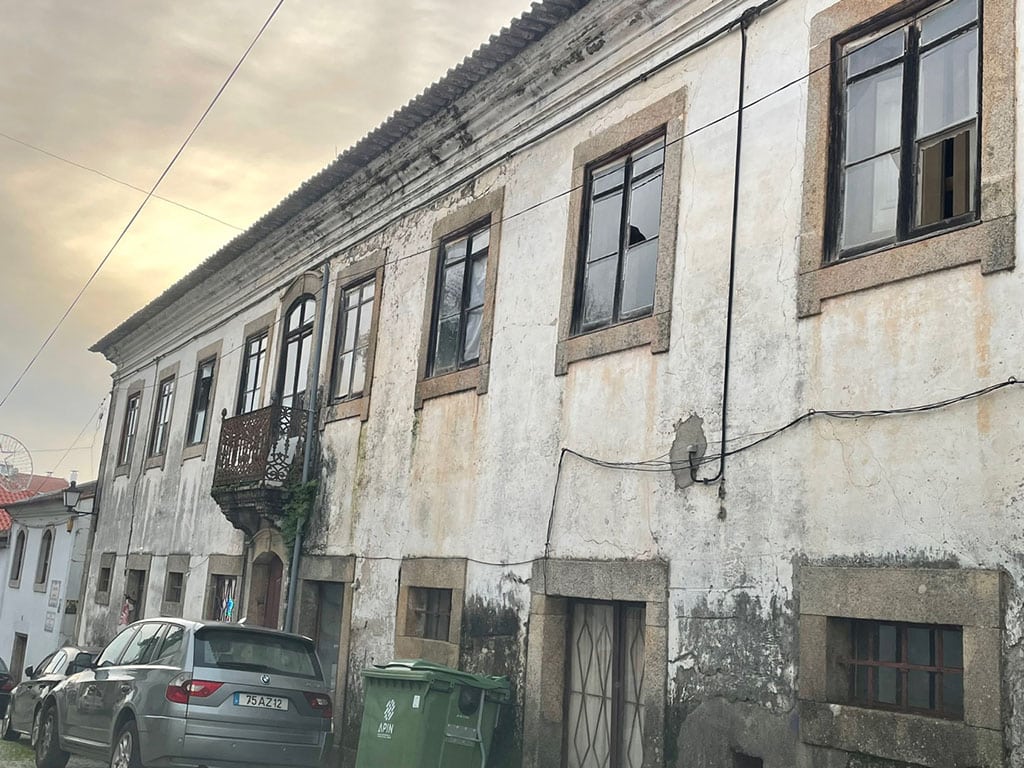 Old mansion for sale in Pedrógão Grande|1868 date stone set in the wall at Casa Adelina, above Station of the Cross II|1960s roof being dismantled in early-1800s townhouse|Interior of abandoned house with cheap wooden ceiling concealing original beams|Removal of internal divisions to create modern, larger spaces|This type of renovation work is not for the faint-hearted|View over the river Zêzere at Pedrógão Pequeno