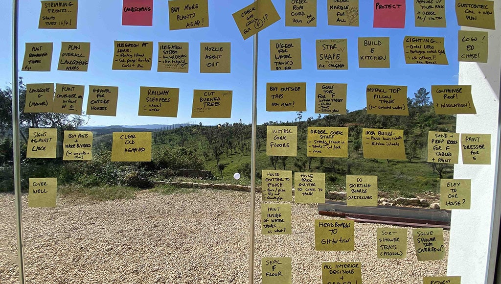 The to-do list as an art form: the post-it note wall|The Big Picture: things are really starting to take shape. We hope the beautiful green patch we planted will help boost the vineyard-to-be|Ah, there it is: the cable (here) can now be connected in the little house (here), saving us huge amounts of time and money.|Phases of the pool: applying a preparatory layer before the final finish|Roman-style talha amphorae and a pink sunset over Vale das Estrelas