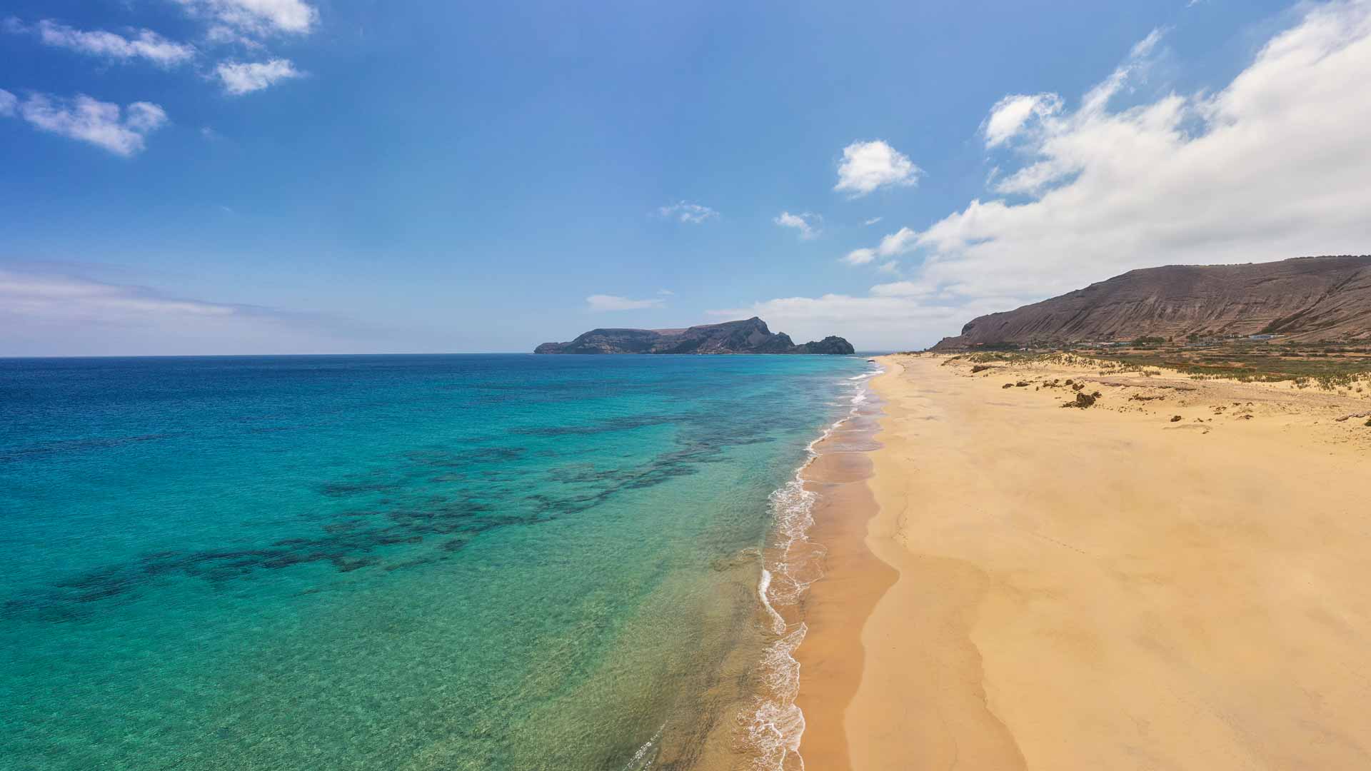 Praia do Porto Santo (Visit Madeira/Henrique Seruca)|Lisbon (Pexels/Skitterphoto)