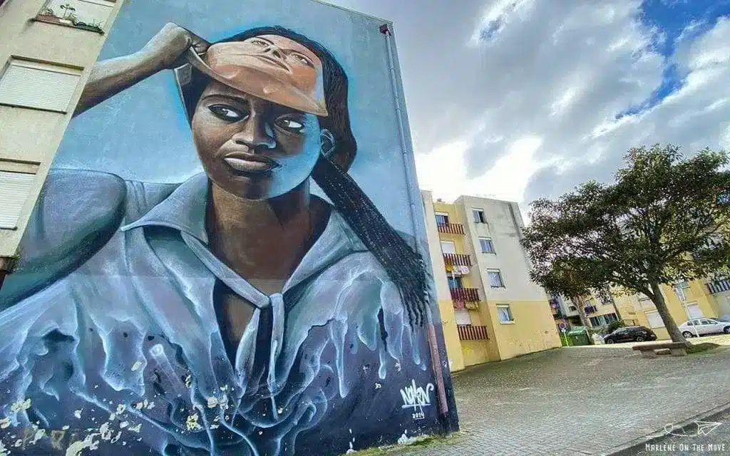 Quinta do Mocho is also known for its street art which evokes the 'problems' residents face: Image: https://marleneonthemove.com/quinta-do-mocho-street-art-lisboa/|Quinta do Mocho is also known for its street art. Image: https://marleneonthemove.com/quinta-do-mocho-street-art-lisboa/