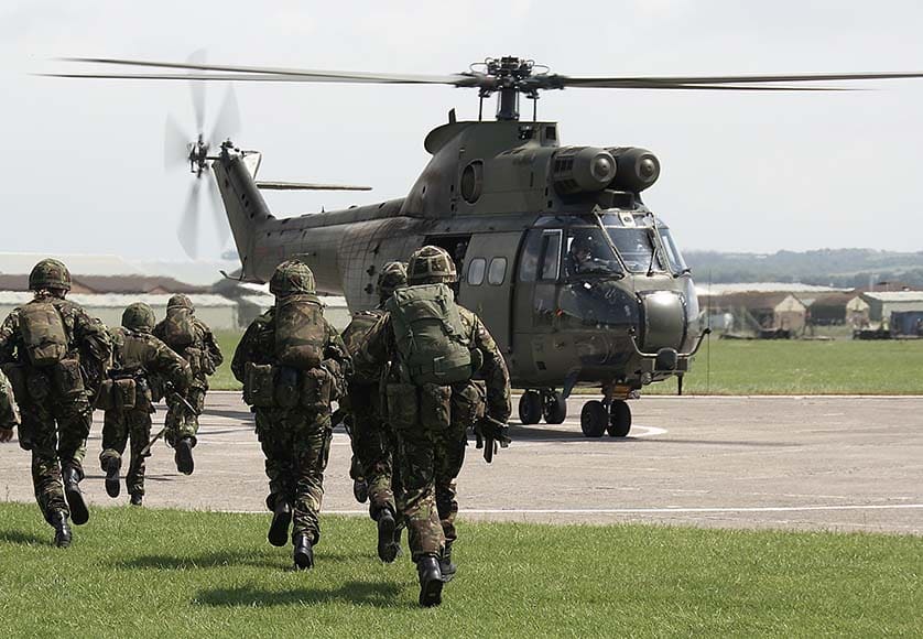 UK soldiers board puma helicopter|Royal Navy|Military pilot boarding his fighter plane at sunset