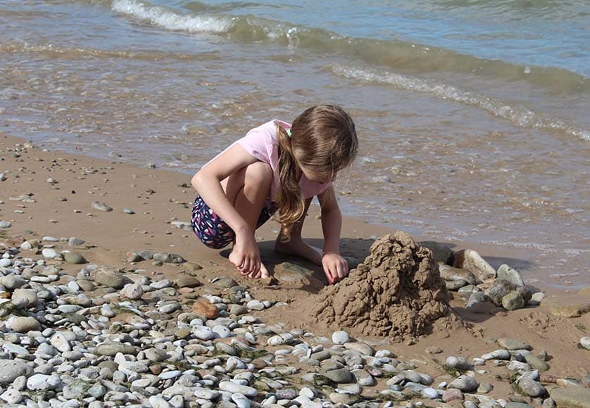 child playing on the beach