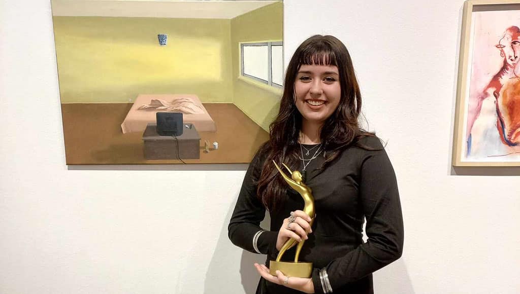 Sara with her trophy and oil painting|Sara's Fading away - public vote winner 2022