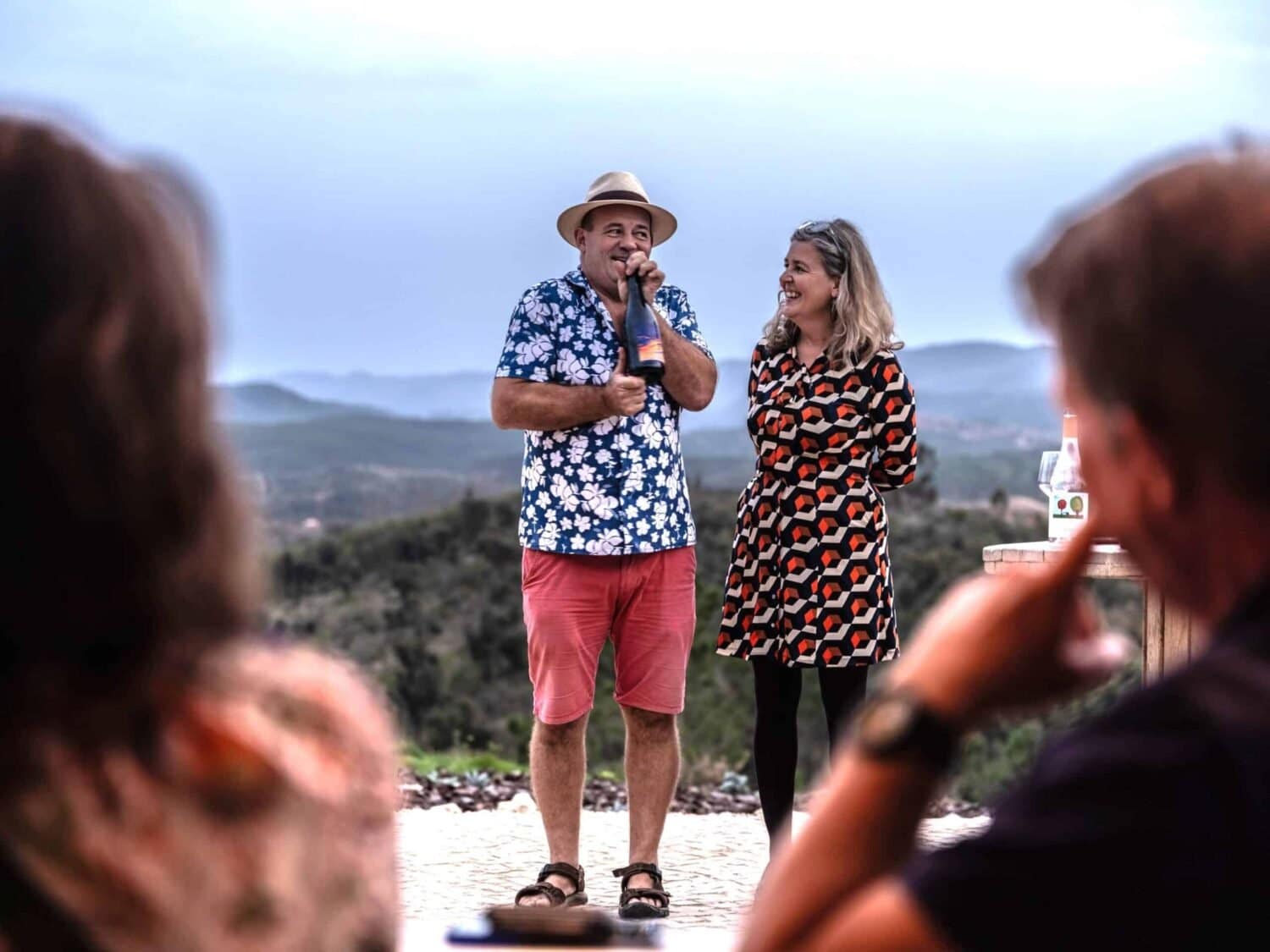 Exciting wines: Alastair and Ana unveiling their first wine - Photo courtesy of Tim Freccia|Beautiful backdrop: Tom Bilton telling the story of Howard’s Folly and their amazing old vine field blends at a Valley of the Stars wine tasting|Full flow: Tom explained how a Yorkshireman met an Australian and created an Alentejo wine and a beautiful Estremoz winery -Photo courtesy of Tim Freccia|Full flow: Tom explained how a Yorkshireman met an Australian and created an Alentejo wine and a beautiful Estremoz winery - Photo courtesy of Tim Freccia|The taste of success? The first wine event at Vale das Estrelas|Bottled up: Alastair with winemaker Mauro Azóia with the first bottle of the new wine|All set: there’s something very special about having your own wine label|Fancy a rosé? The skies match the wine in the valley|Off Grid and Ignorant in Portugal: The big plan for a second life … and why it’s all about wine