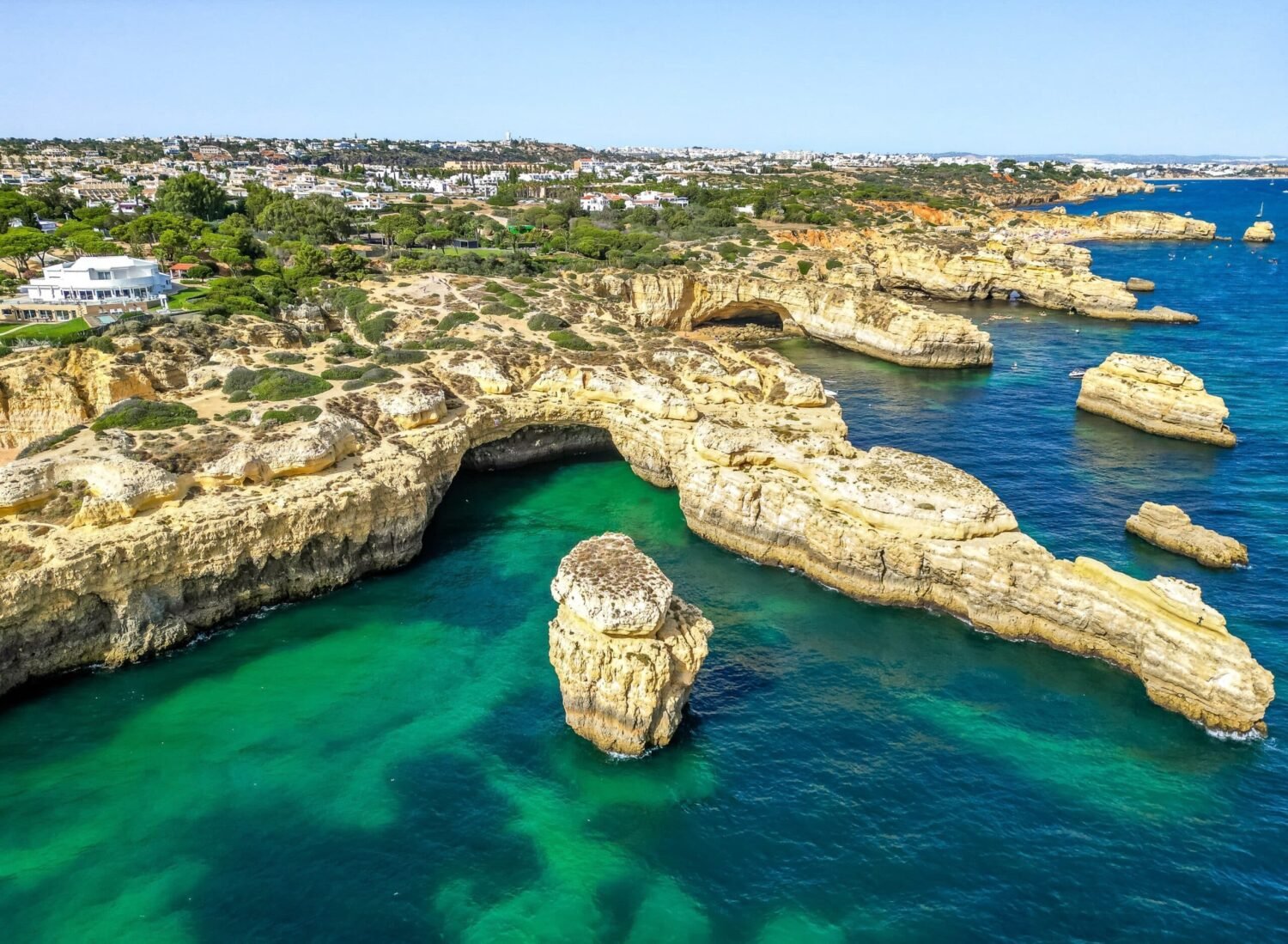 Algarve's rugged coastline - Photo: That Drone Imagery/Shutterstock|Quinta do Lago|Quinta do Lago|Vale do Lobo|Flamingos, Salgados|Demand for Algarve property increases; new projects unveiled|2098_Nobilus_05_Garden|Villa Magna, Porches|Villa Magna bedroom