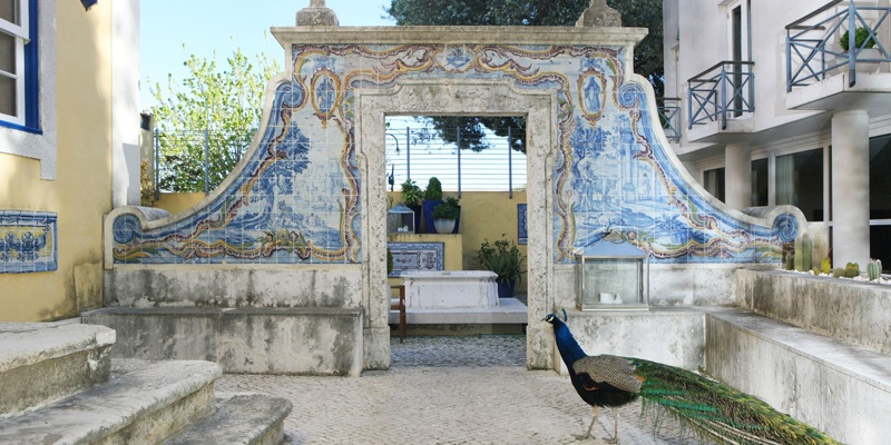 |View of library of the As Janelas Verdes hotel located in a building that's part of Lisbon’s history|View of the Penthouse Room in the Heritage Avenida da Liberdade hotel located in a building that's part of Lisbon’s history|View of the hall at the Hotel Britania which is located in a building that's part of Lisbon’s history|View of the Chill Out Room at the Lisboa Plaza hotel which is located in a building that's part of Lisbon’s history|