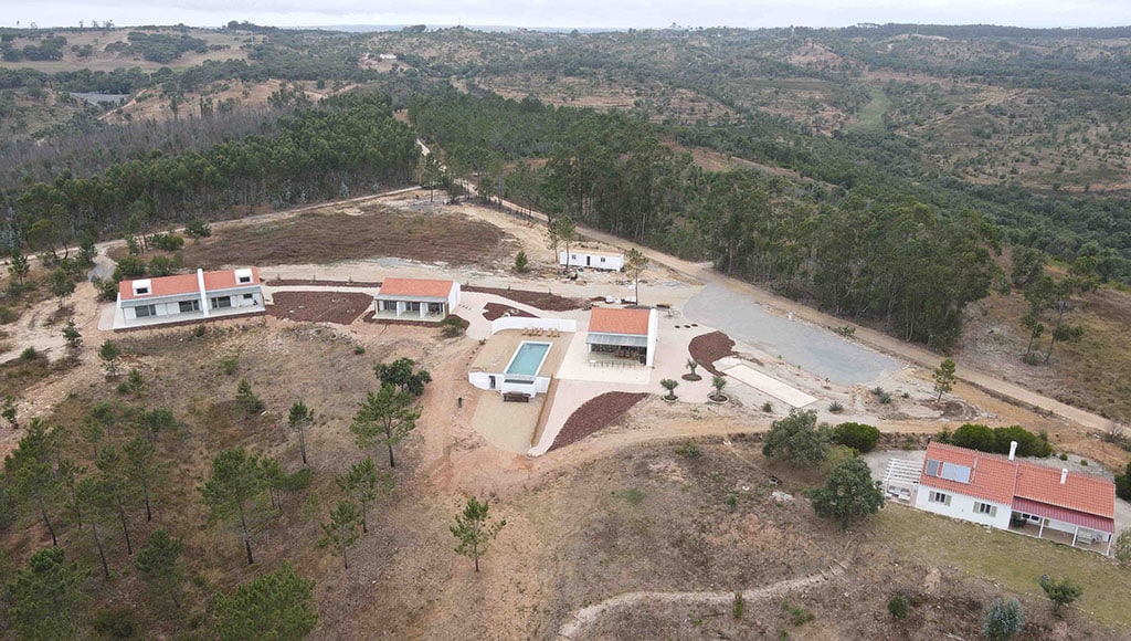 Big picture: the latest aerial view of our project…the insides now need attention|Spoilt for choice: the dogs were given Kenyan collar upgrades|We’re no mugs: but the nudge is our neighbour Daniel’s latest gift|Spreading the love: mounds of bark ready to be spread on the land and in the heart-shaped area on the left|Water nightmares: Having planned it, now I need to learn how it all works