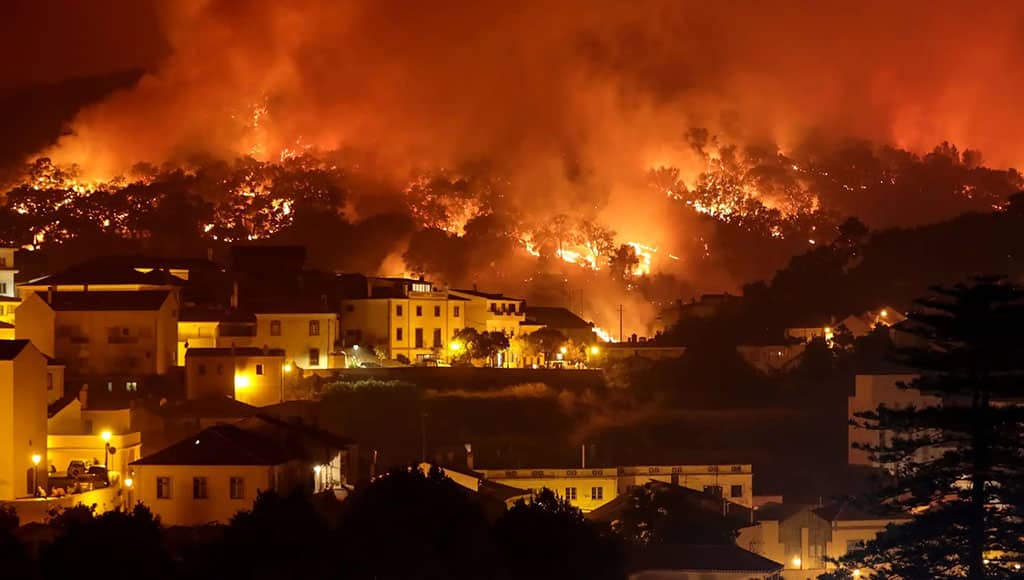 Wildfire reaches Monchique|Aeroplane dropping water on the wildfire|James and Tony with Derek as they leave|Photo from European Space Agency showing smoke around Monchique|Road back to the valley