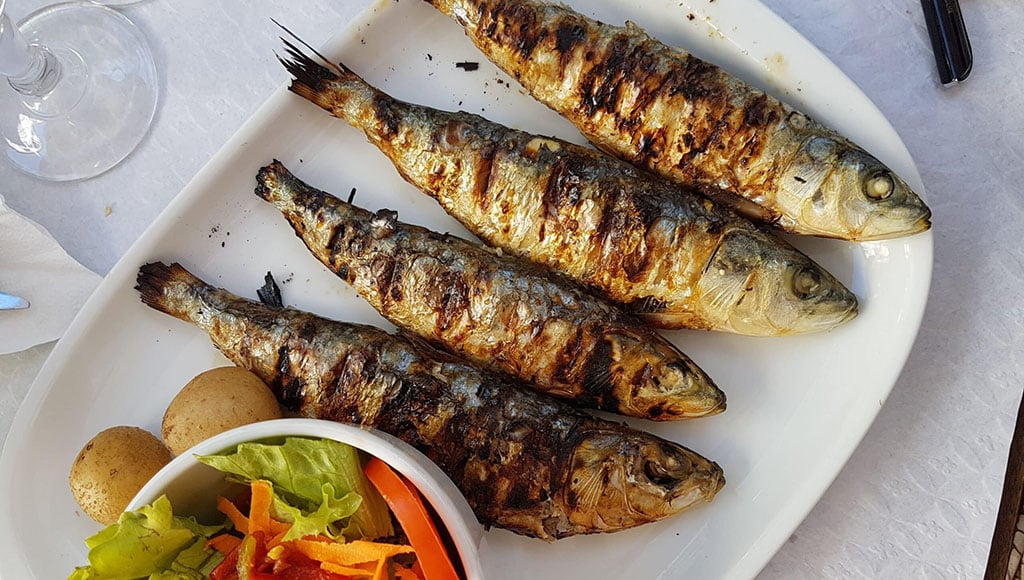Grilled sardines are one of the most popular dishes in the Algarve (Photo: Alex Teixeira/Unsplash)