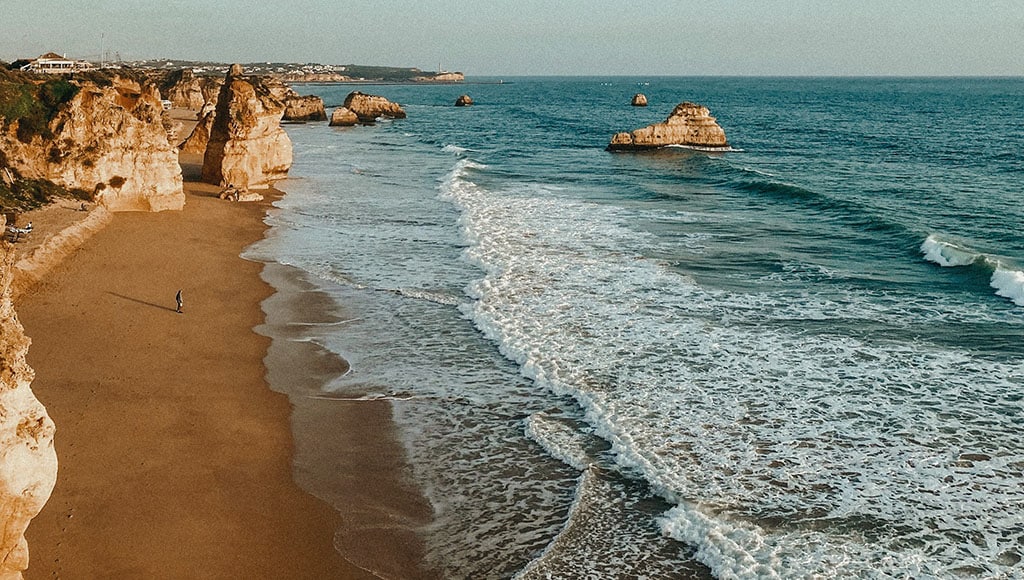algarve-activities-wine-tasting-quinta-dos-vales|algarve-tours-activities-quinta-dos-vales|quinta-dos-vales-wine-estate-algarve|People clinking glasses with wine on the summer terrace of cafe or restaurant, glass bottle in hands different backgrounds