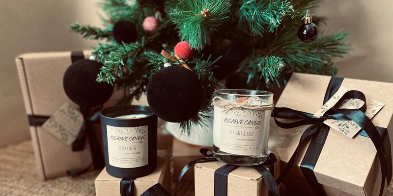 Handmade natural candles by the Christmas tree