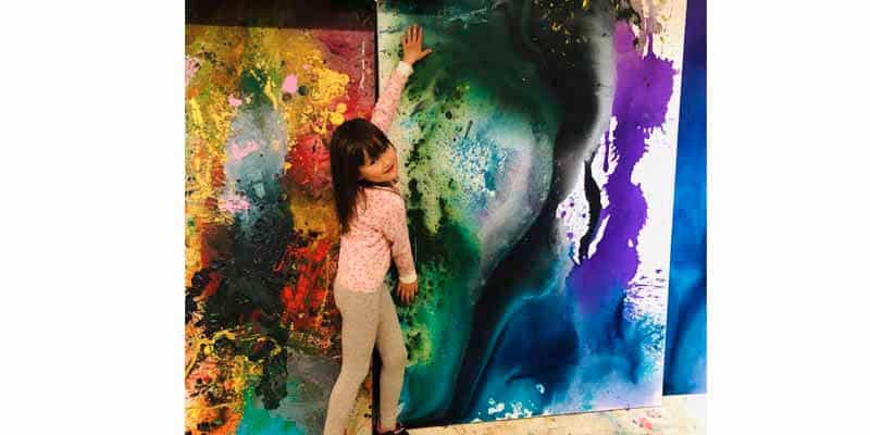 Five-year-old artist auctions paintings for charity