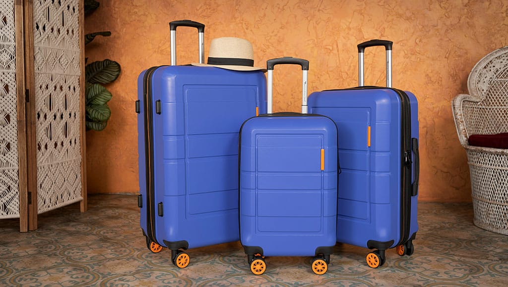 three blue suitcases