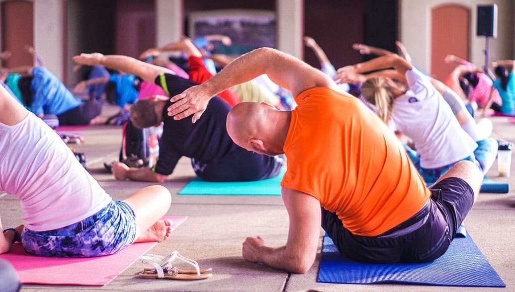 group of people practising yoga