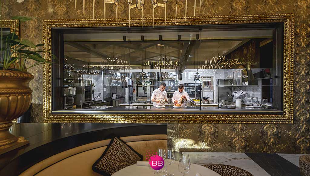 Partial view of the dining room and kitchen area at the Authentic restaurant|Photo of a lobster plate served at Authentic restaurant|Celebrating the festive season in style at Authentic