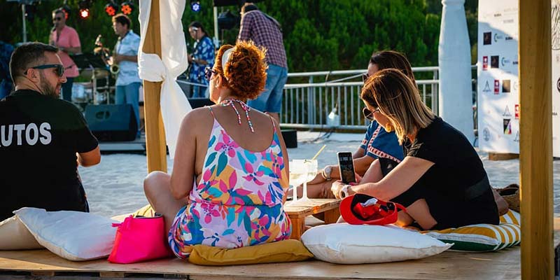Strings & Things Band perform on a sandy rooftop