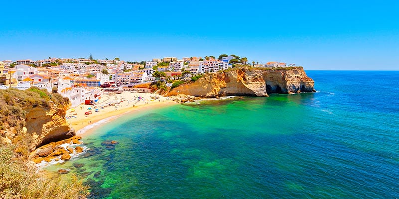 Photo of an Algarve village by the sea, a region where Blevins Franks has one of their wealth management offices|blevins_franks_2_sep_2023|blevins_franks_3_sep_2023